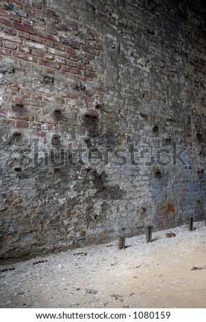 Brick wall inside abandoned paper factory