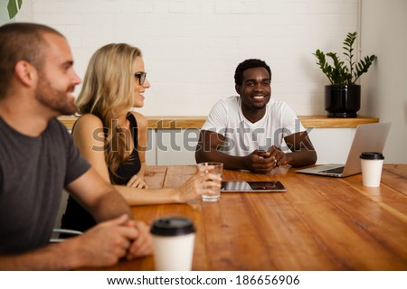 Technology startup entrepreneurs meeting at a boardroom table
