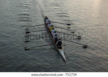Early morning rowers training on the river.