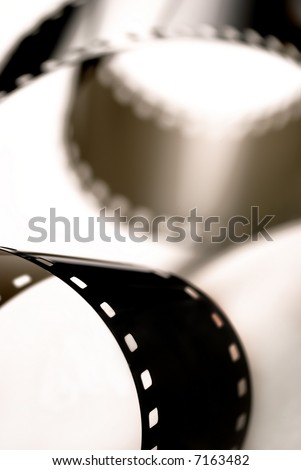 close-up detail of a roll of photographic film over white background