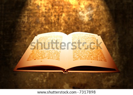 open book of sacred religious text with spot light effect