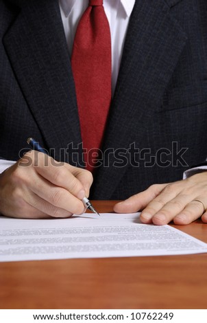 close up of a businessman signing a contract