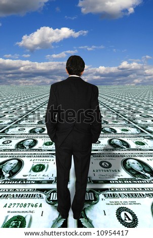businessman standing on a dollars floor