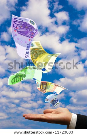 businessman hand with open palm and euro banknotes flying all around