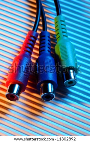 red green blue video cable connectors over a rugged surface