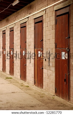 view of a row of doors of an horse stable