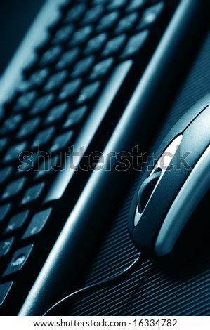 close-up detail of a modern computer mouse and keyboard