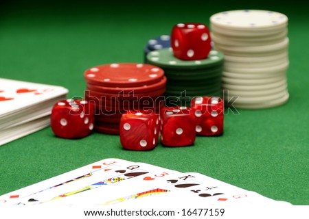 playing cards, dices and fiches on the green table