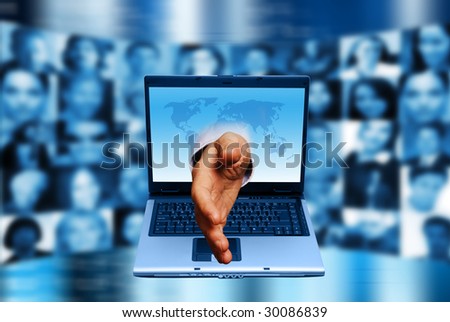 hand coming out of a laptop monitor with people faces in background, social network concept