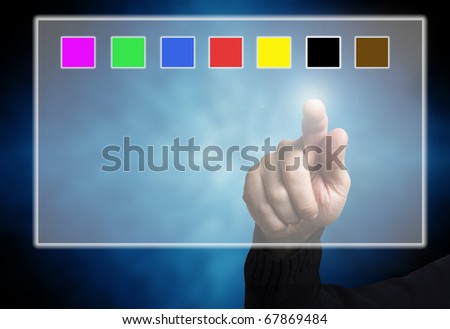 a hand touching a screen with color swatches. Concept for digital designer at work