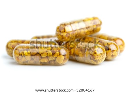 stock photo : Some homeopathic pills with bee pollen isolated on the white 