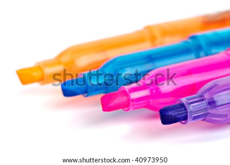 Opened different colored felt-tip markers close-up. White background. Shallow DOF. Focus point - violet marker