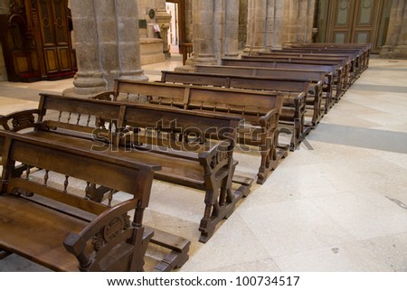 Old, wooden benches of church inside Santiago de Compostela Church