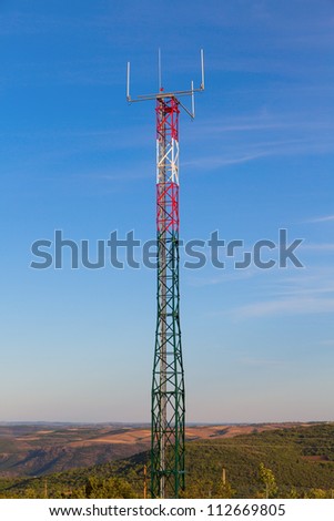 detailed view of communication tower over blue sky