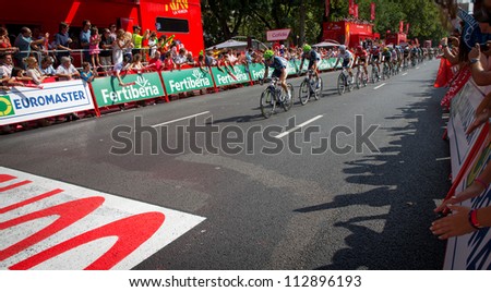 MADRID - SEPTEMBER 9: Spanish Vuelta (cycling), Movistar team leading the main group in the final stage of the vuelta on September 9, 2012 in Madrid (Spain).