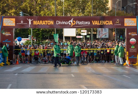 VALENCIA - NOVEMBER 18: Many unidentified runners prepared at start line of mens marathon, in Valencias marathon on November 18, 2012 in Valencia, Spain