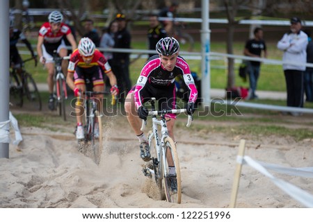 VALENCIA - DECEMBER 16: Javier de Ruiz (number 3, Lizarte team) leads main group over sand pit in XXVII edition of Cyclo-cross city of Valencia on December 16, 2012 in Valencia, Spain