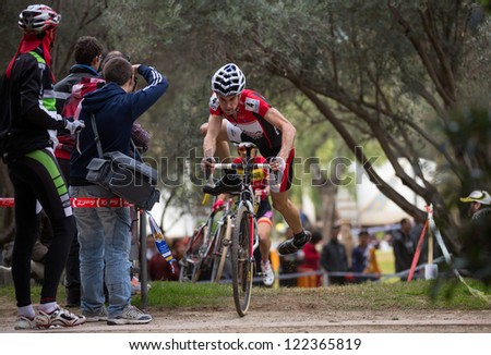 VALENCIA - DECEMBER 16: Aitor Hernandez (number 4, and finally winner, orbea team) participates in XXVII edition of Cyclo-cross city of Valencia on December 16, 2012 in Valencia, Spain