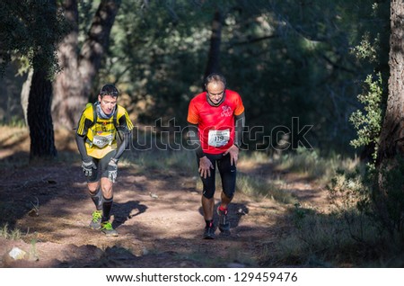 CASTELLON - FEBRUARY 24: Angel Montero (119) and Jose maria Cuellar (586) participate in XV Edition of Espadan mountain marathon on February 24, 2013 in Castellon, Spain