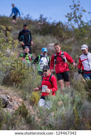 CASTELLON - FEBRUARY 24: Andres Calabria (number 378) leads his group during descent in XV Edition of Espadan mountain marathon on February 24, 2013 in Castellon, Spain