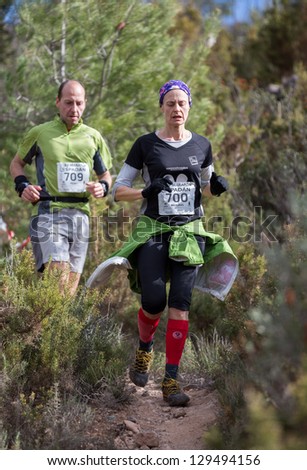 CASTELLON - FEBRUARY 24: Milagros Morales (number 700) leads group during her participation in XV Edition of Espadan mountain marathon on February 24, 2013 in Castellon, Spain