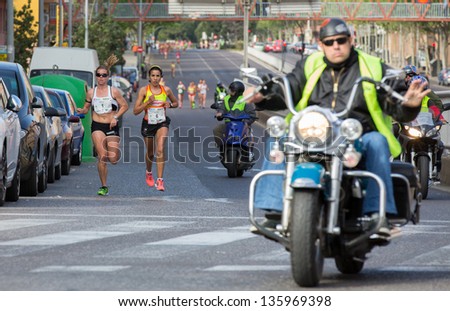 VALENCIA - APRIL 21: Fatima Ayachi (number 6) and Raquel Landin (number 1) lead race during women race against cancer in Valencias on April 21, 2013 in Valencia, Spain