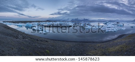 Big panorama of Jokulsarlon lake in Iceland under midnight sun light
