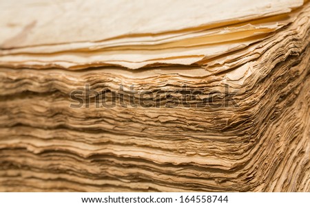 Side view of open antique book sheets