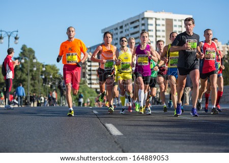 VALENCIA - NOVEMBER 17: Paco Martinez (number 204) leads his group during his participation in Valencias marathon on November 17, 2013 in Valencia, Spain