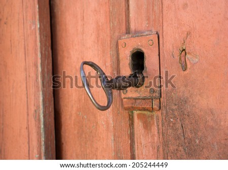 Closeup of vintage lock and door with antique key
