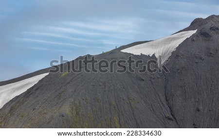 Lava mountain and tourists in the mountain skyline landscape, Landmannalaugar, Iceland
