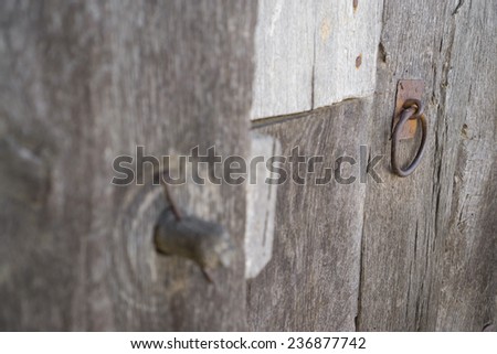 Closeup of vintage run-down wooden door wooden lock