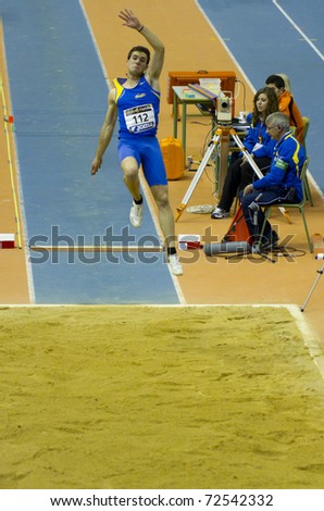 VALENCIA, SPAIN - FEBRUARY 19: Eusebio Caceres competes in the long jump for men at the Spanish Indoor National Championships at Valencia on February 19, 2011 in Valencia, Spain