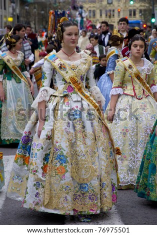 VALENCIA, SPAIN - MARCH 16: Women walking in the presentation of the fallas, one of the biggest parties in Spain where people dresses traditionally on march 16, 2011 in Valencia, Spain