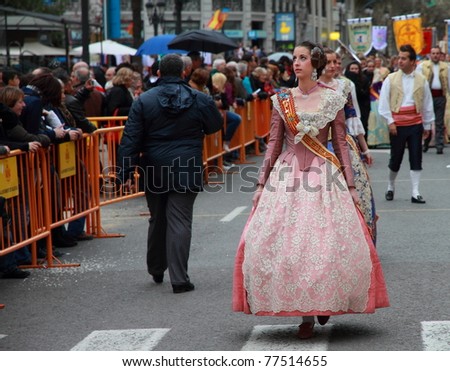 VALENCIA, SPAIN - MARCH 16: An unidentified Women walks in the presentation of the Fallas, one of the biggest parties in Spain where people dress in vintage clothing on March 16, 2011 in Valencia, Spain