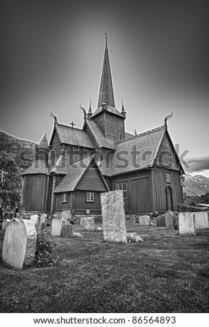 Viking, Norwegian Church and graves on a stormy day. Black and White vertical view
