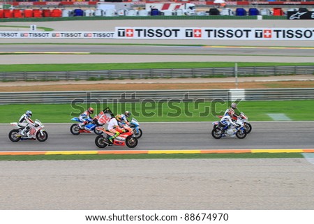 CHESTE, SPAIN  - NOVEMBER 6: All categories drivers and Kevin Schwantz tribute to Marco Simoncelli with a lap in his memory at final race of Grand Prix 2011 on November 6, 2011 in Cheste (Valencia), Spain