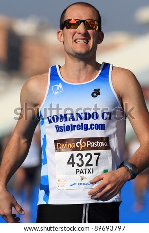 stock-photo-valencia-november-paxi-runner-number-finishing-the-race-in-valencias-marathon-on-89693797.jpg