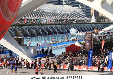 VALENCIA - NOVEMBER 27: Runners at Finish line of Marathon race at the incredible environment of Santiago Calatrava's architect famous buildings on November 27, 2011 in Valencia, Spain