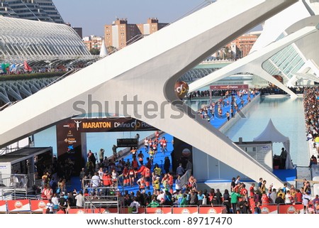VALENCIA - NOVEMBER 27: Runners at Finish line of Marathon race at the incredible environment of Santiago Calatrava\'s architect famous buildings on November 27, 2011 in Valencia, Spain