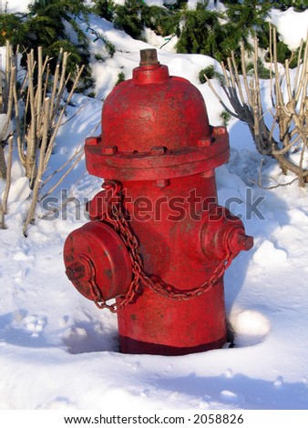 A Red Fire Hydrant Sitting In The Snow