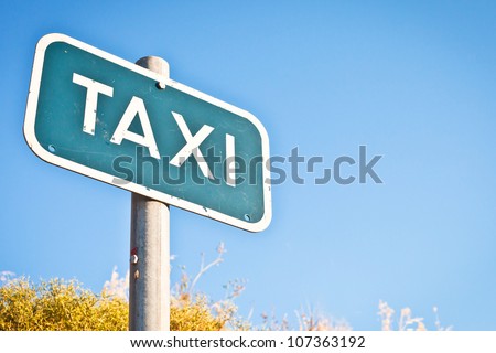 Taxi sign with copyspace and a summer feel