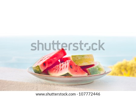 Freshly cut pieces of water melon on a plate outside
