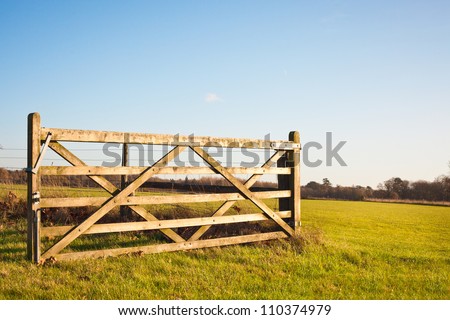 stock-photo-an-open-gate-on-farmland-in-