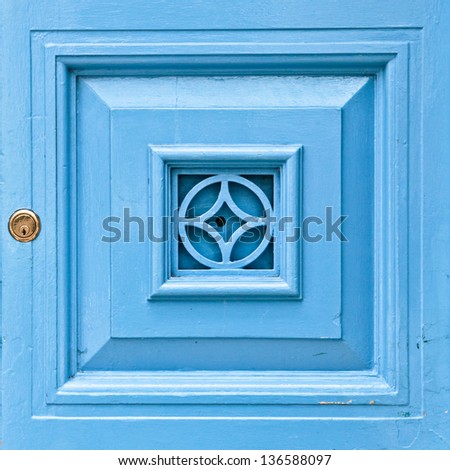 Blue wooden door panel with a lock as a background