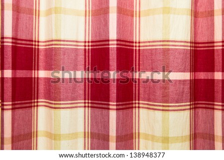Red and yellow patterned curtain cloth as a background