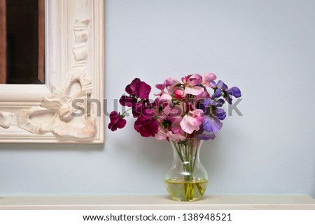 Flowers on a mantle piece in a vintage home