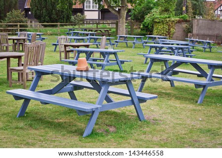 Tables and chairs in a pub garden in England