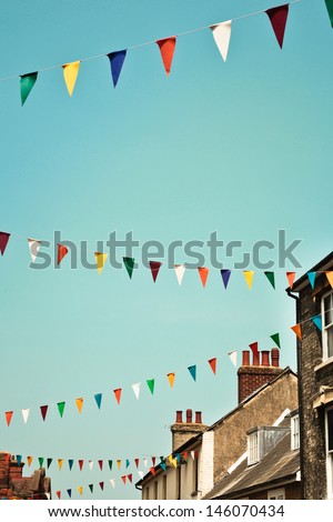Bunting against a blue summer sky in a UK town