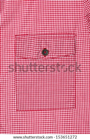 Pocket on the front of a red gingham ladies\' blouse
